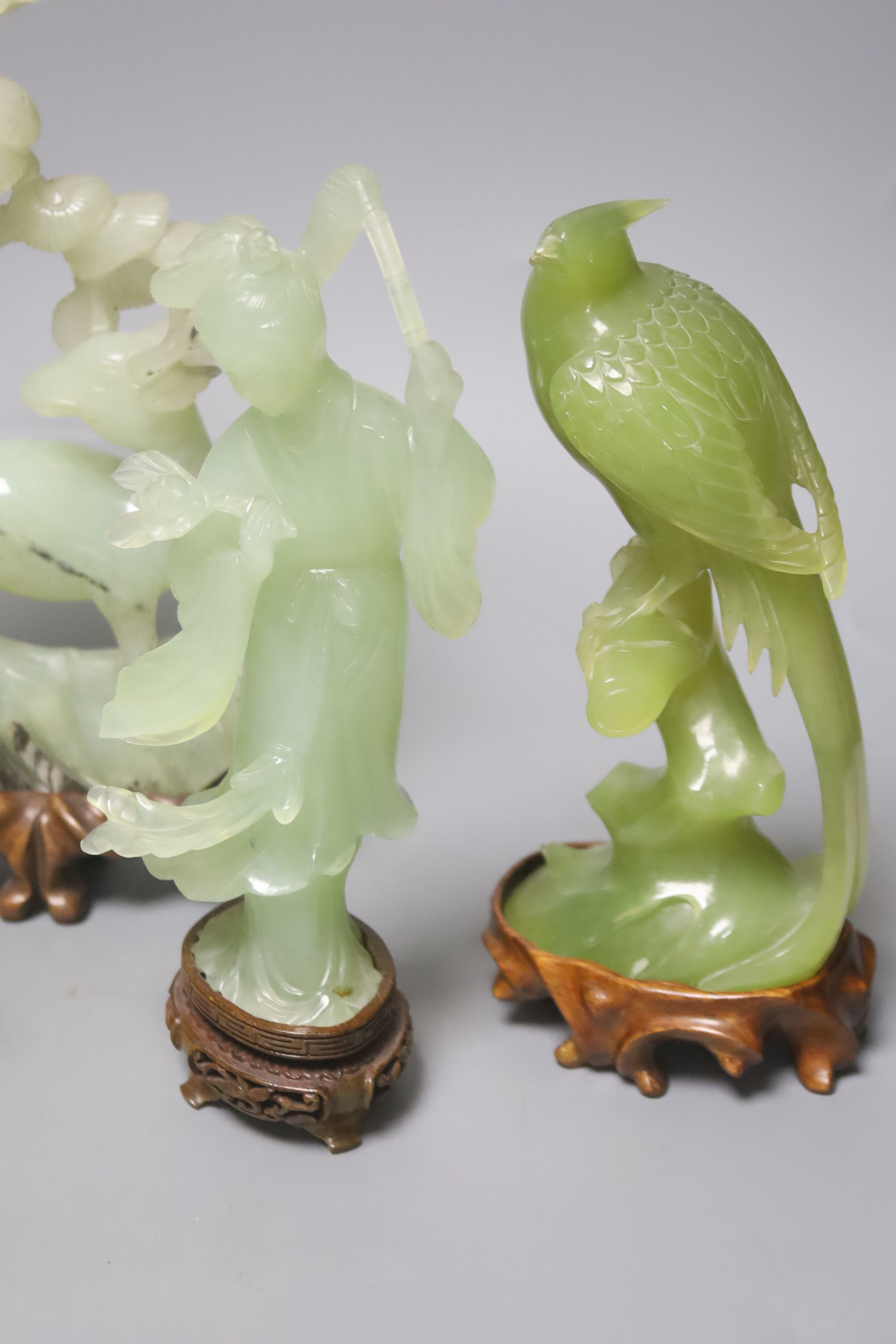 A pair of Chinese bowenite carvings of exotic birds on a branch and four Chinese hardstone items,